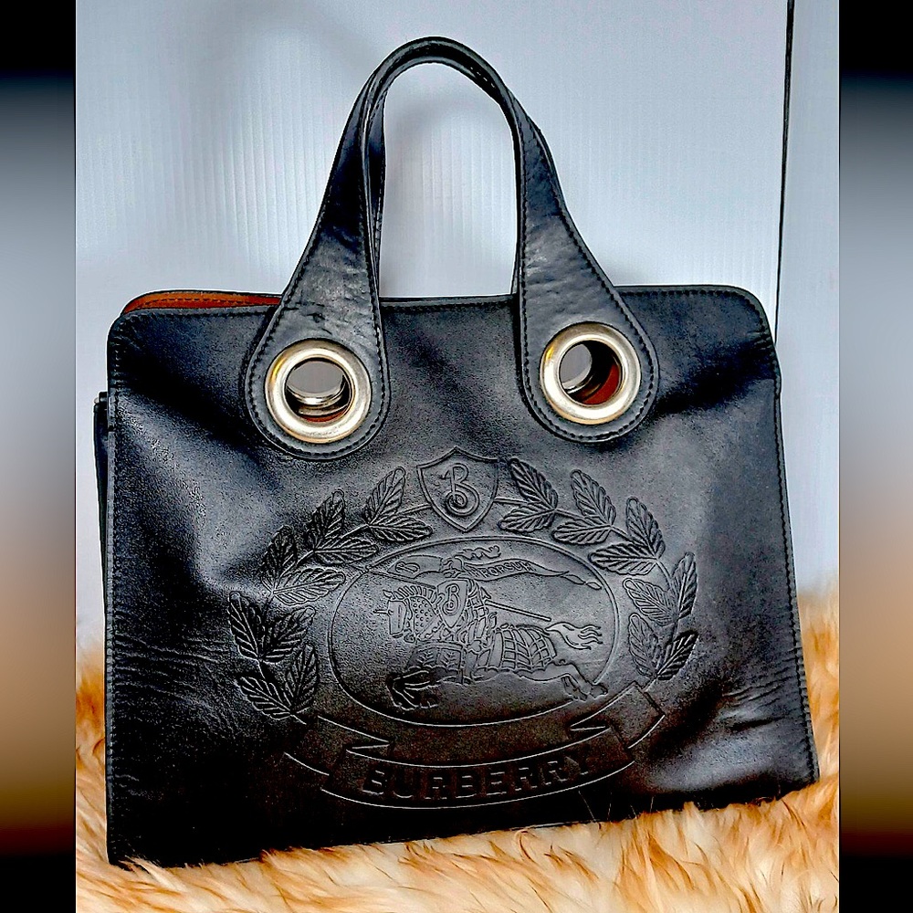Authentic BURBERRY Calfskin Small Grommet Embossed Crest Bag in Black.